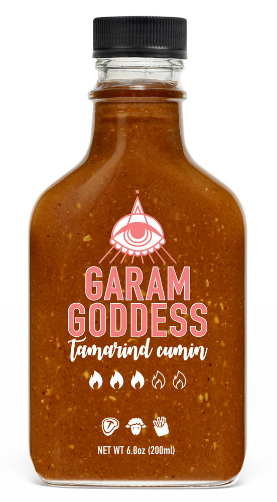 Garam Goddess Tamarind Cumin hot sauce bottle with deep amber label, representing its rich, Indian-inspired flavors with spices like scotch bonnet pepper, coriander, fennel, tamarind, dates and cumin